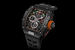Richard Mille, модель RM 50-03 Tourbillon Split Seconds Chronograph Ultralight McLaren F1. Корпус и ремешок часов изготовлены с применением графена. Самый легкий механический хронограф в мире (вес механизма – 7 г), а общий вес часов с учетом ремешка – 40 г