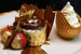 В  Дубае в кафе Bloomsbury, расположенном в торговом центре Dubai Mall, подают кекс - The Golden Phoenix стоимостью 1000$. В состав кекса входят съедобное золото (пластинки и посыпка), итальянский шоколад, органическая клубника. Десерт готовится долго, поэтому заказывать его лучше за сутки