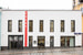 Фасад магазина КМ-20 до 20 октября преобразился  по случаю открытия поп-ап пространства Prada Linea Rossa