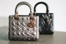 Две вариации cумки Lady Dior Art от группы Recycle серебряного и черного цвета выпущены в трех размерах