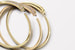 Panthere de Cartier, одна из знаковых ювелирных коллекций французского Дома, пополнилась тонкими гибкими браслетами и подвесками – новым дизайном классических моделей. Открытые, не смыкающиеся браслеты, на одном конце которых красуется голова дикой кошки, а на другом ее условный хвост, представлены сразу в шести вариациях – из гладкого розового или желтого золота, дополненные еще в четырех версиях бриллиантовым паве на голове животного, а также на хвосте пантеры. В версии с наибольшим количеством бриллиантов их общий вес составляет 2,33 карата. По традиции этой коллекции «лик» дикой кошки, или пантеры, выполнен как миниатюрная скульптура, ее глаза созданы из изумрудов или цаворитов, а нос – из оникса. Благодаря специальной технологии новые браслеты имеют облегченную гибкую конструкцию и, чтобы надеть украшение на запястье, достаточно развести два его конца в сторону. Дизайнеры Cartier предлагают сочетать разные версии браслетов между собой и носить их смотрящими друг на друга головами пантер. Стилистически новые украшения исполнены так, что гармонично могут сочетаться с совершенно любым другим объектом из обширной коллекции Panthere de Cartier. 