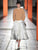 Простой джемпер и необычная юбка – узнаваемый образ Prada на протяжении многих лет. В коллекции FW 2023/24 появились образы в стиле оригами, главным украшением которых стали хрупкие цветы, словно вырезанные из бумаги, – на самом деле они выполнены из кружева и шифона